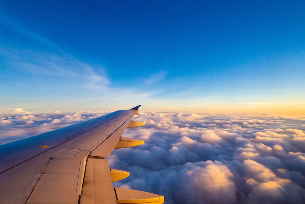 plane wing with sunset