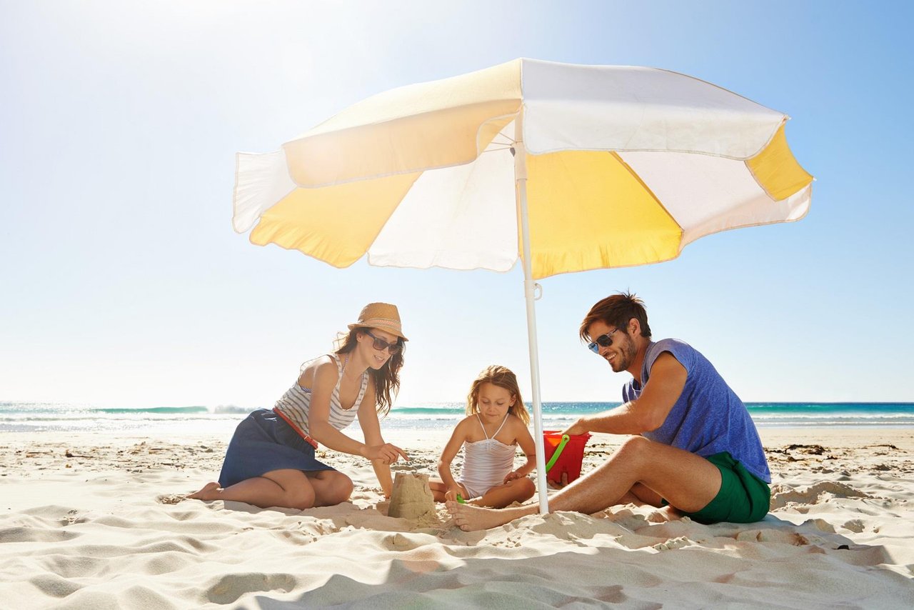 Family making sandcastles