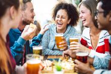 friends laughing at an emerald coast brewery